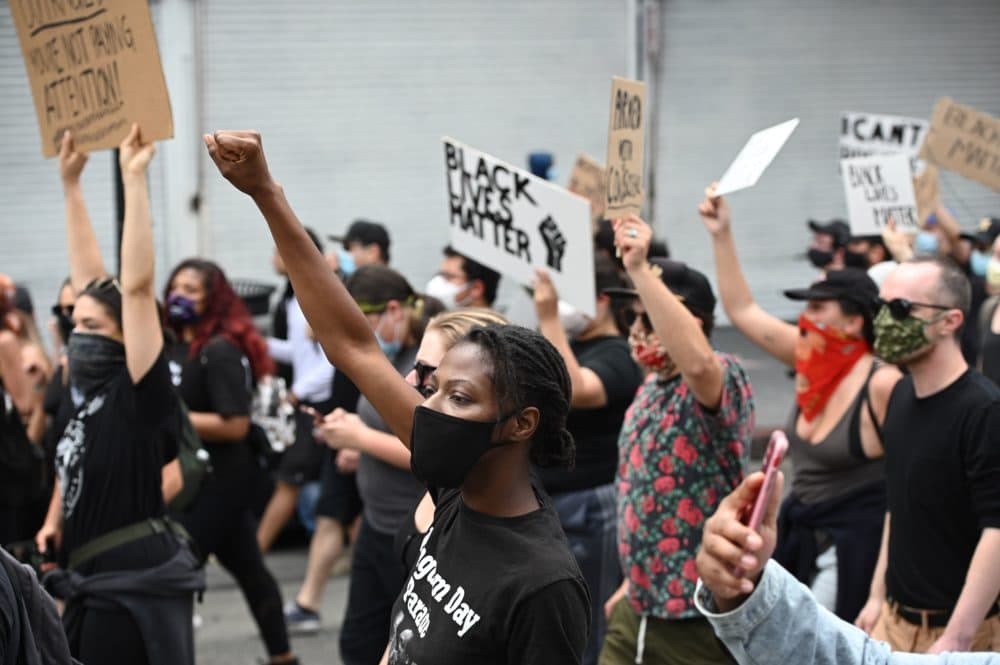 Demonstrators march through the streets of Hollywood, California, on June 2, 2020, to protest the death of George Floyd at the hands of police. (Robyn Beck/AFP via Getty Images)