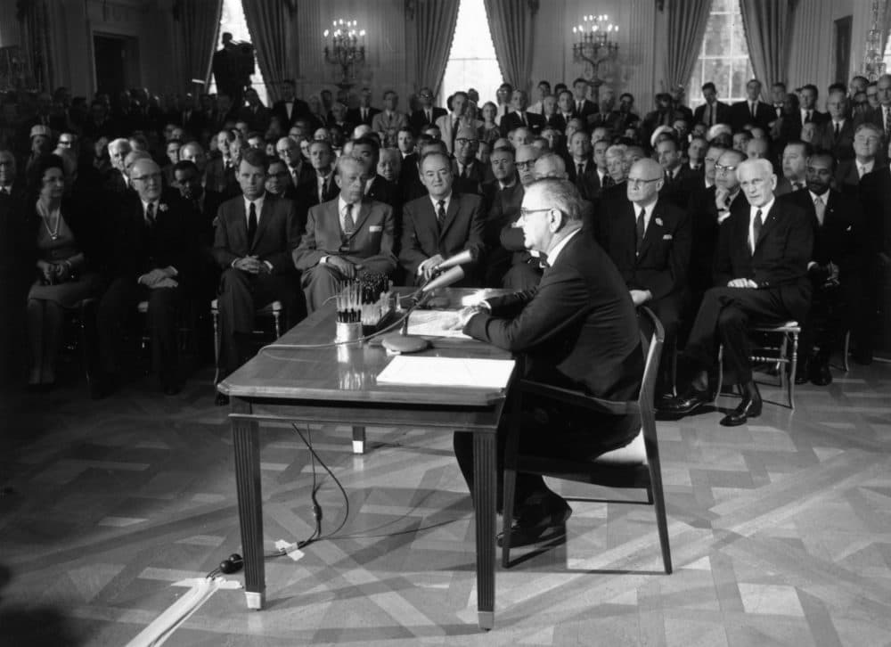 Senators and other U.S. leaders listening to former President Lyndon Johnson making a speech in the East Room of the White House during the signing of the Civil Rights Bill. Third from left in the front row is Senator Robert Kennedy and fifth from left, Vice President Hubert Humphrey. (Keystone/Getty Images)