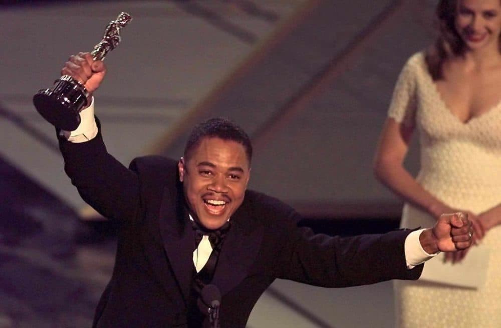 Cuba Gooding, Jr holds up his Oscar after winning the Best Supporting Actor Award for his role in "Jerry Maguire" during the 1997 Academy Awards. (Timothy A. Clary/AFP via Getty Images)