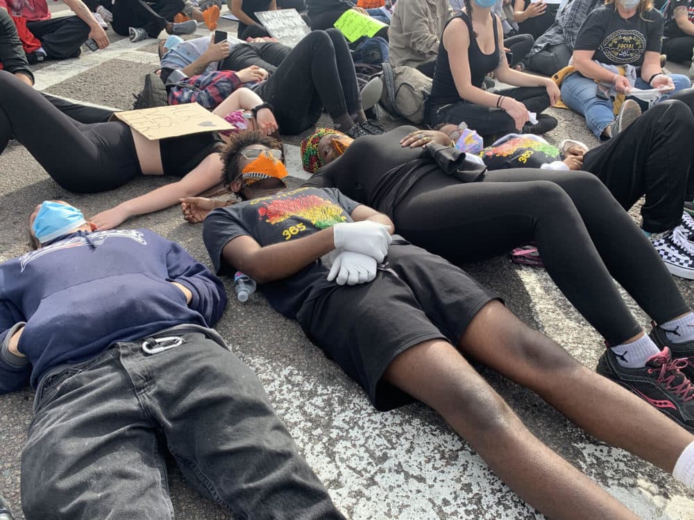 Some protesters participated in the "die-in" at the march. (Jesse Costa/WBUR)