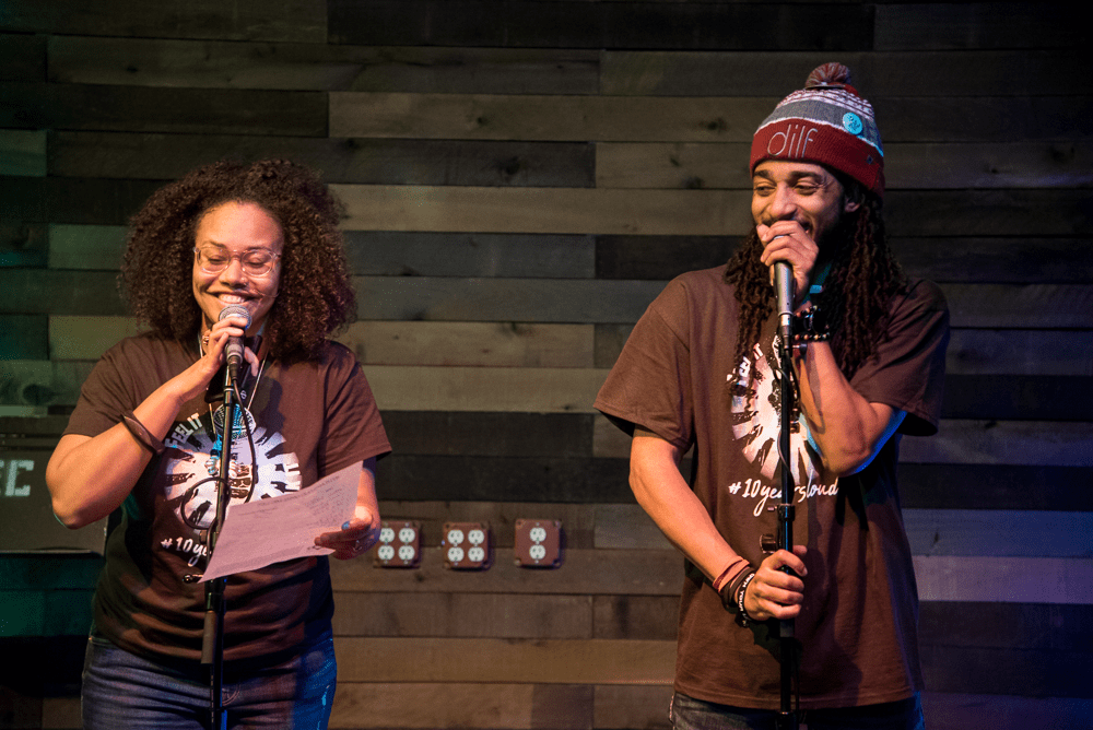 Jha D Williams and D. Ruff introduce the ground rules for the "If You Can Feel It, You Can Speak It" open mic at its 10th-anniversary celebration in 2019. (Courtesy Bryan Trench/The Event Shooters)