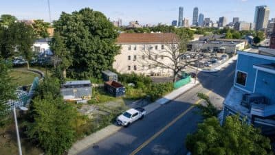 On this site in Roxbury, developers are planning to build a five-story, mixed-use building out of a "revolutionary" type of timber. (Robin Lubbock/WBUR)