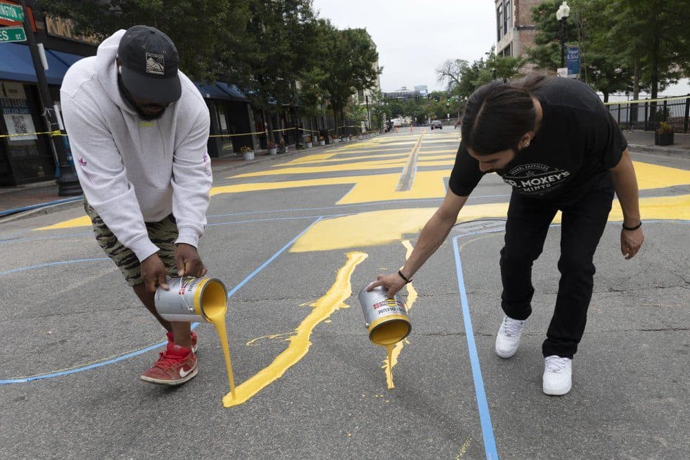 Lee Beard, left, and Mar paint the phrase Black Lives Matter on Washington Street, Sunday, July 5, 2020, in Roxbury. (Michael Dwyer/AP Photo)