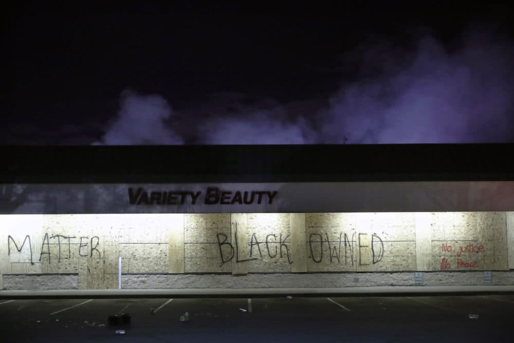 A business labeled "Black Owned" remains untouched on May 29, 2020, in Minneapolis. (John Minchillo/AP)