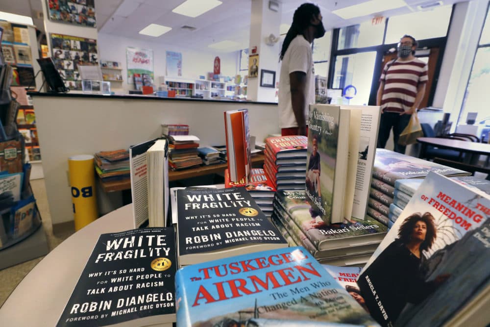 In this June 24, 2020, photograph, books are displayed, including "The Tuskegee Airmen," and "White Fragility," at the Black-owned Frugal Bookstore in the Roxbury neighborhood of Boston. (Charles Krupa/AP)