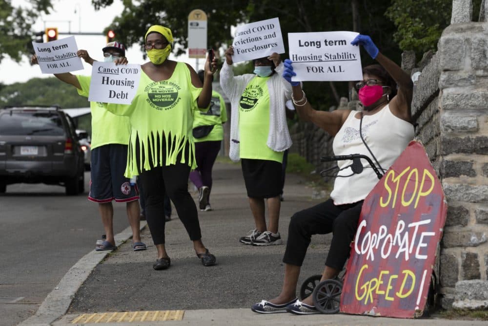 People rally for protection from evictions on June 27 in Mattapan. (Michael Dwyer/AP)