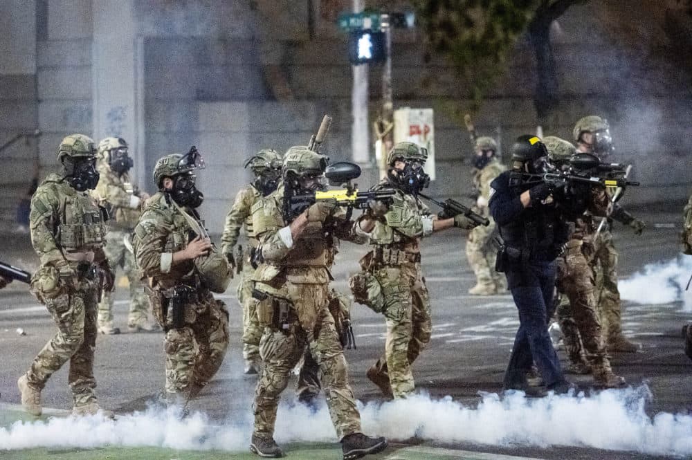 Federal agents use crowd control munitions to disperse Black Lives Matter protesters at the Mark O. Hatfield United States Courthouse in Portland, Oregon. (Noah Berger/AP)