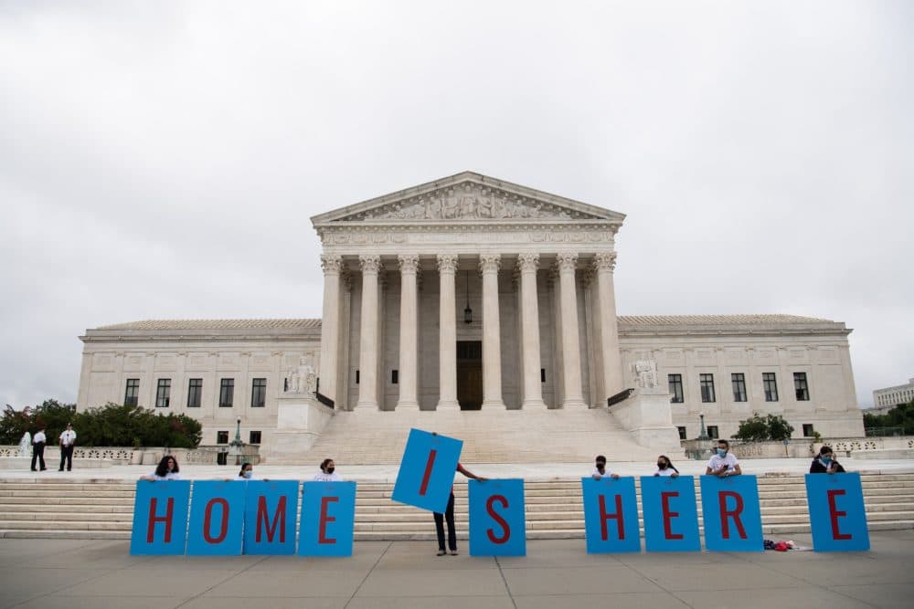 Activists hold a banner in front of the US Supreme Court in Washington, DC, on June 18, 2020. (NICHOLAS KAMM/AFP via Getty Images)