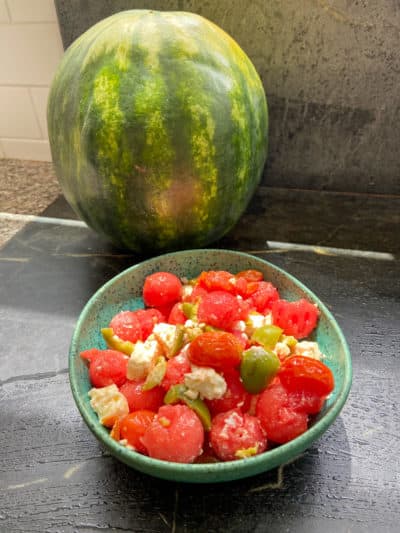 Watermelon, roasted cherry tomatoes, feta, mint and green olive salad. (Kathy Gunst/Here & Now)