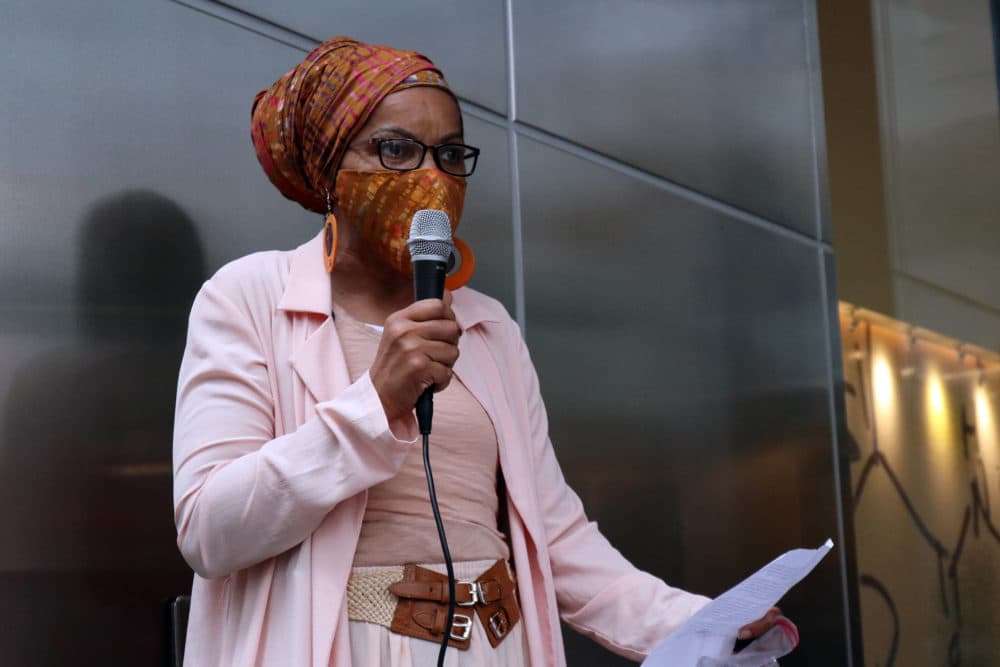 "We need good quality jobs," said Mela Miles, who was among the speakers. "If we're in here, we should not be just janitors. We need to have the actual jobs that are paying like everybody else who is coming from outside Boston ... and taking those jobs. (Adrian Ma / WBUR)