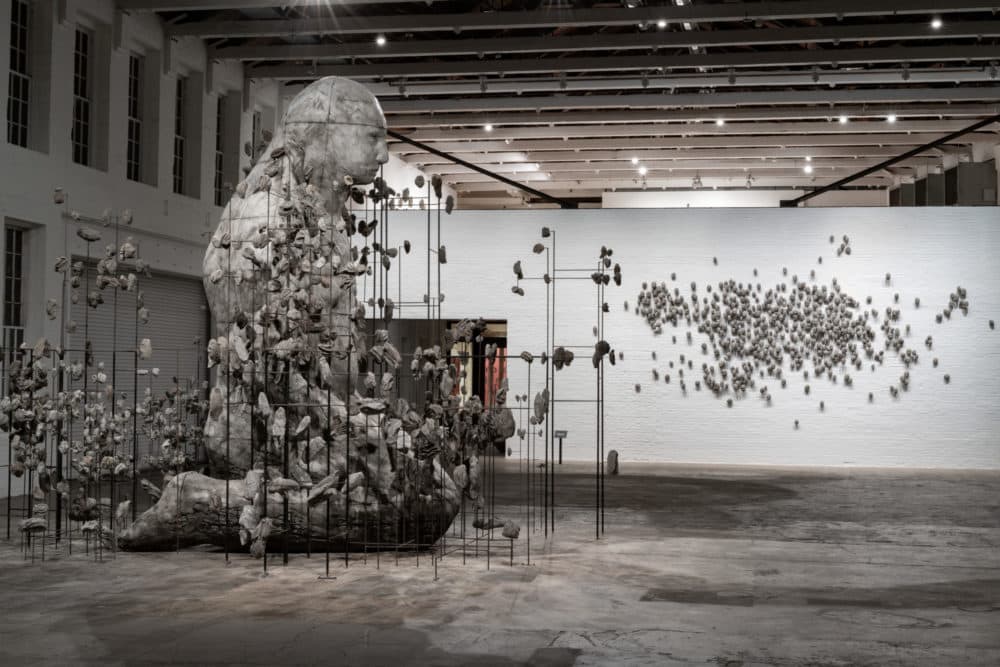 Ledelle Moe's work "When" is 18 feet tall and depicts a kneeling female figure. (Courtesy MASS MoCA/Kaelan Burkett)