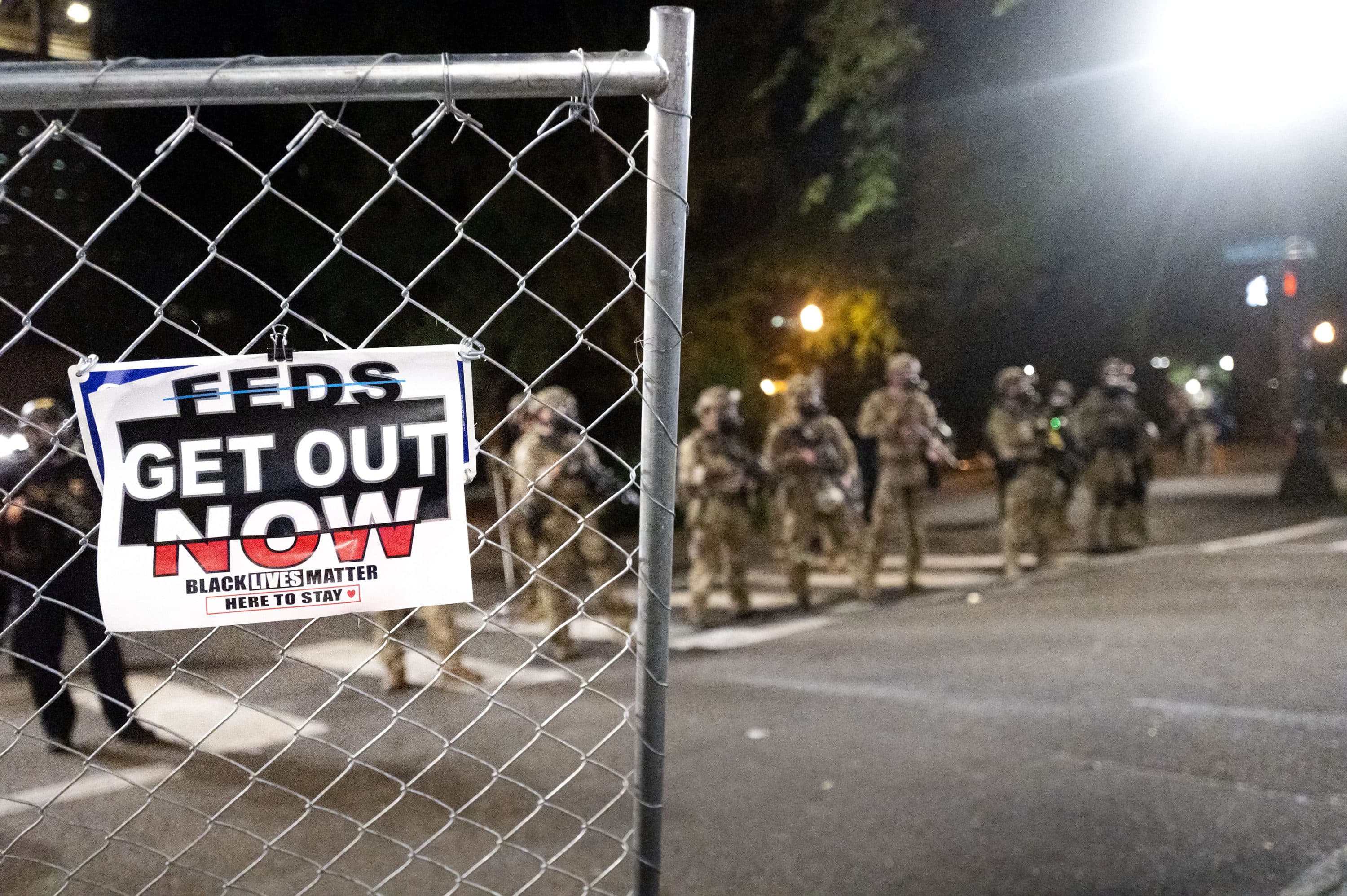 Federal agents disperse Black Lives Matter protesters near the Mark O. Hatfield United States Courthouse on July 20 in Portland, Ore. (Noah Berger/AP)