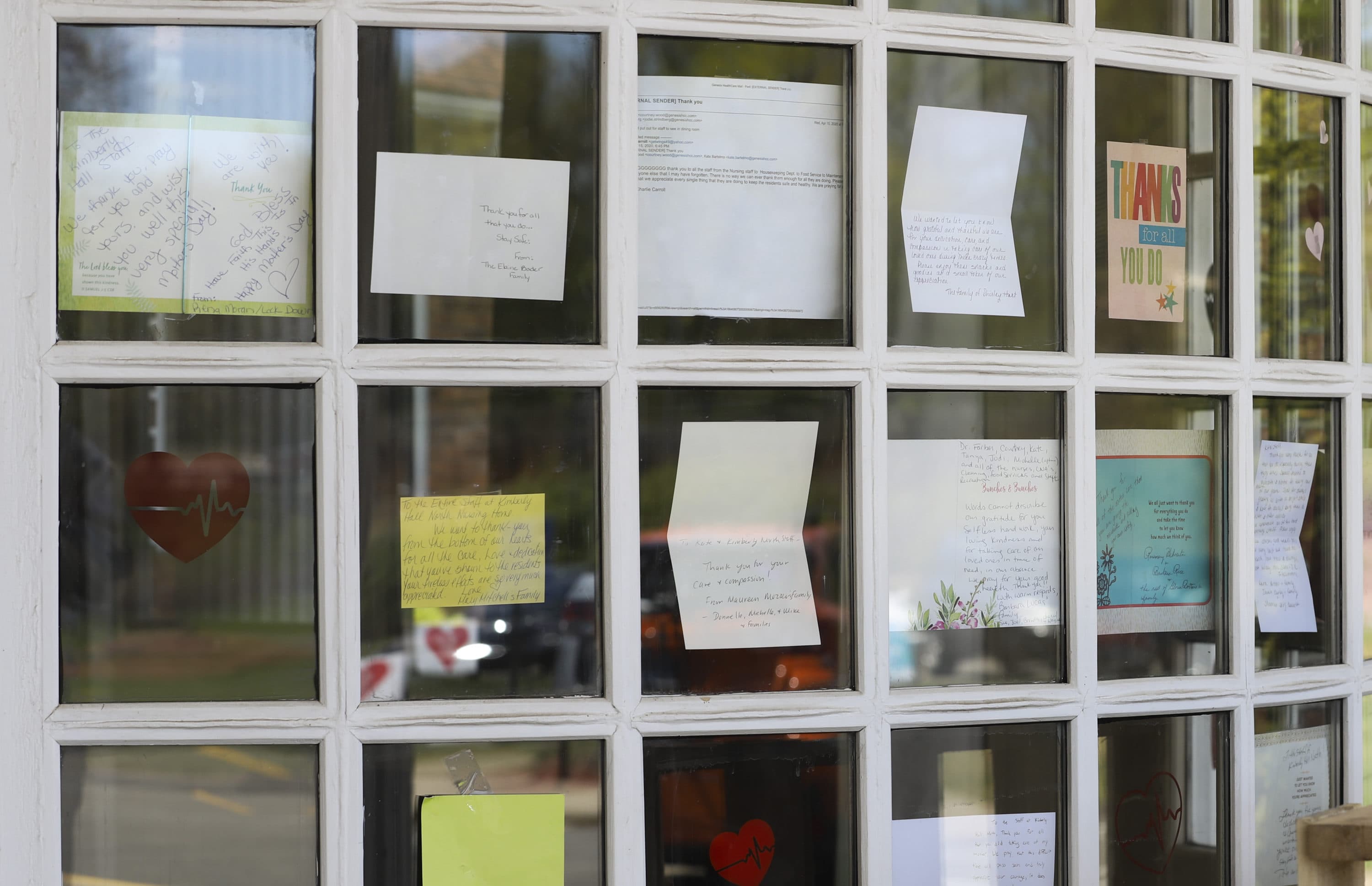 In this May 14, 2020 file photo, notes for healthcare workers hang in the front window at a Connecticut nursing home. (Chris Ehrmann/AP)