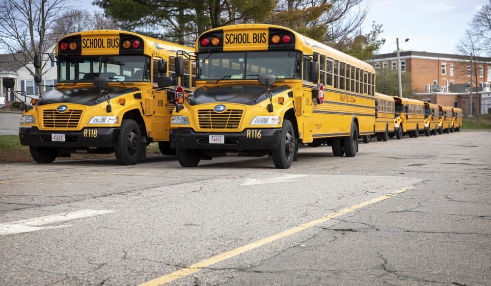 Randolph High School buses parked behind the school. (Robin Lubbock/WBUR)