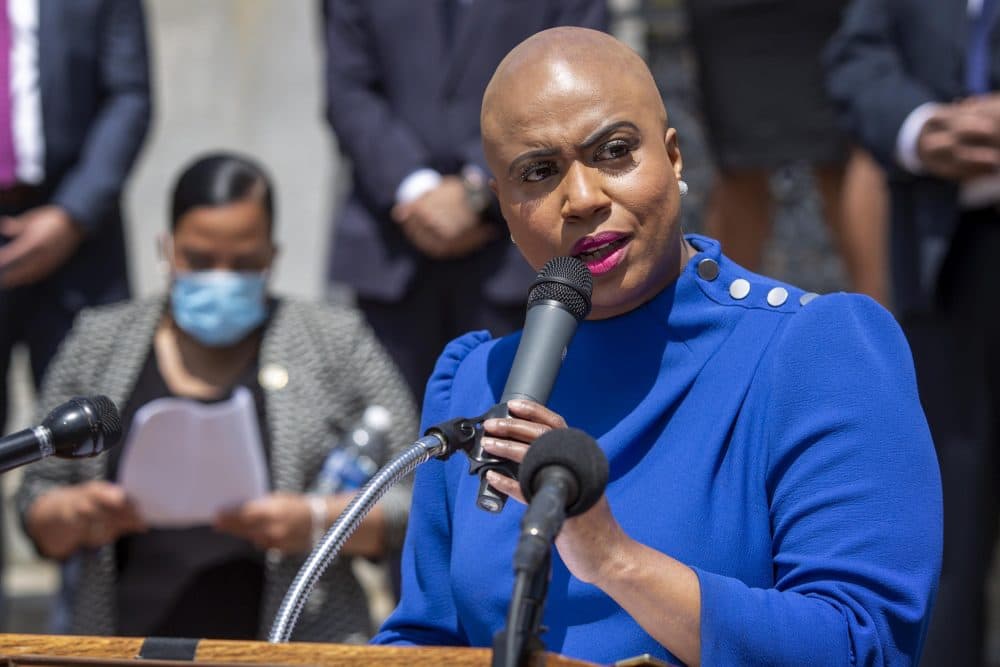 U.S. Rep. Ayanna Pressley, speaking at the gates of the Massachusetts State House. (Robin Lubbock/WBUR)