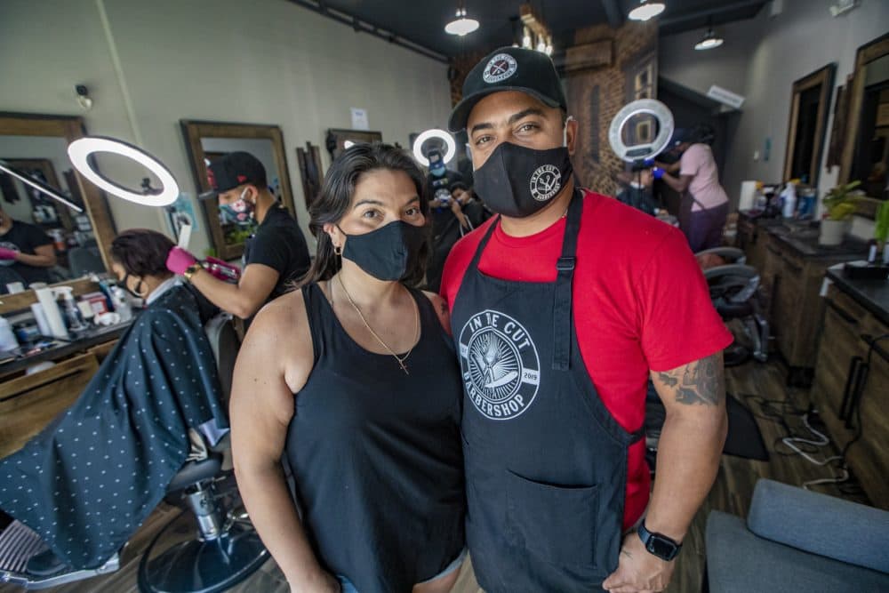 Mission Hill's In The Cut Barber Shop owners Pam Leins and Wellinton “Willy” Garcia. (Jesse Costa/WBUR)