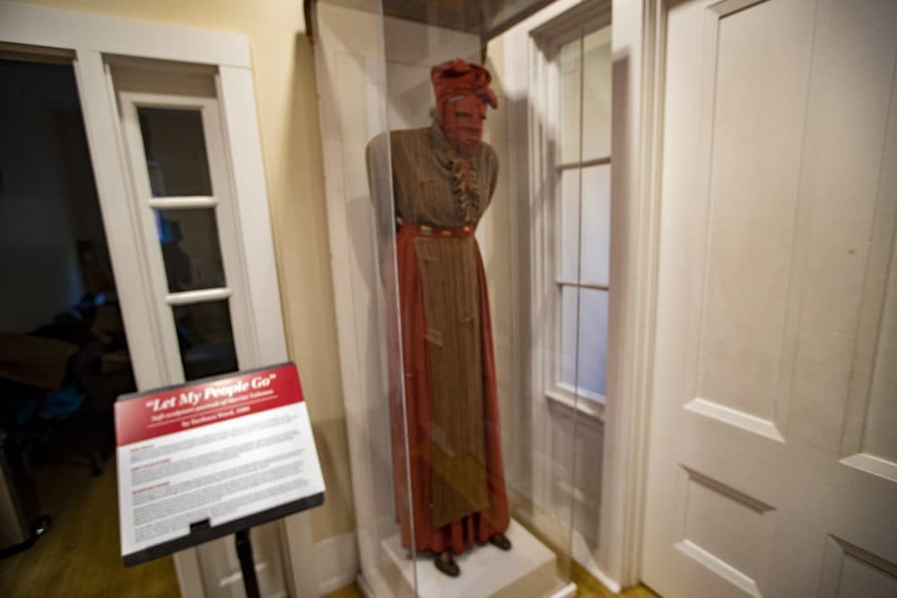 “Let My People Go” is a soft sculpture portrait of Harriet Tubman by artist Barbara Ward. It's displayed at the entrance of USES. (Jesse Costa/WBUR)
