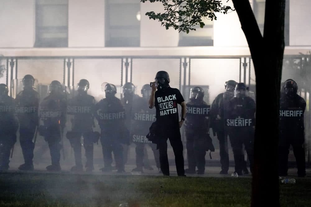 Anger over the Sunday shooting of Jacob Blake, a Black man, by police spilled into the streets for a third nigh in Kenoshat. (Morry Gash/AP)