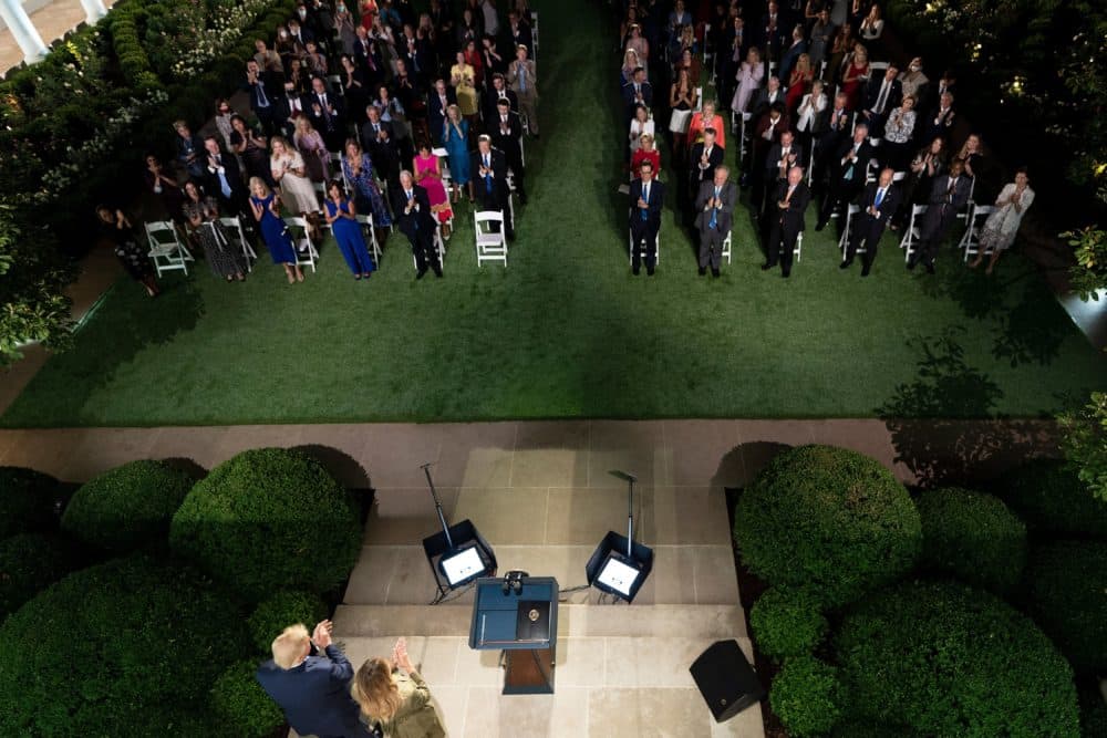 President Donald Trump stands with first lady Melania Trump after she addressed the Republican Convention during its second day from the Rose Garden of the White House August 25, 2020, in Washington, DC. (Brendan Smialowski/AFP via Getty Images)