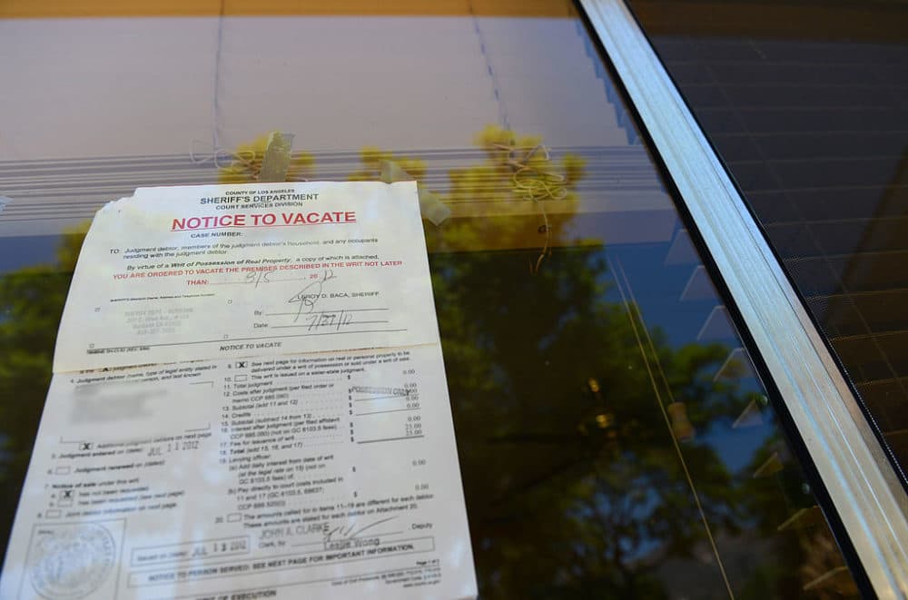 A "Notice to Vacate" is seen in the window of a foreclosed home in Glendale, California, in 2012. (Robyn Beck/AFP/Getty Images)
