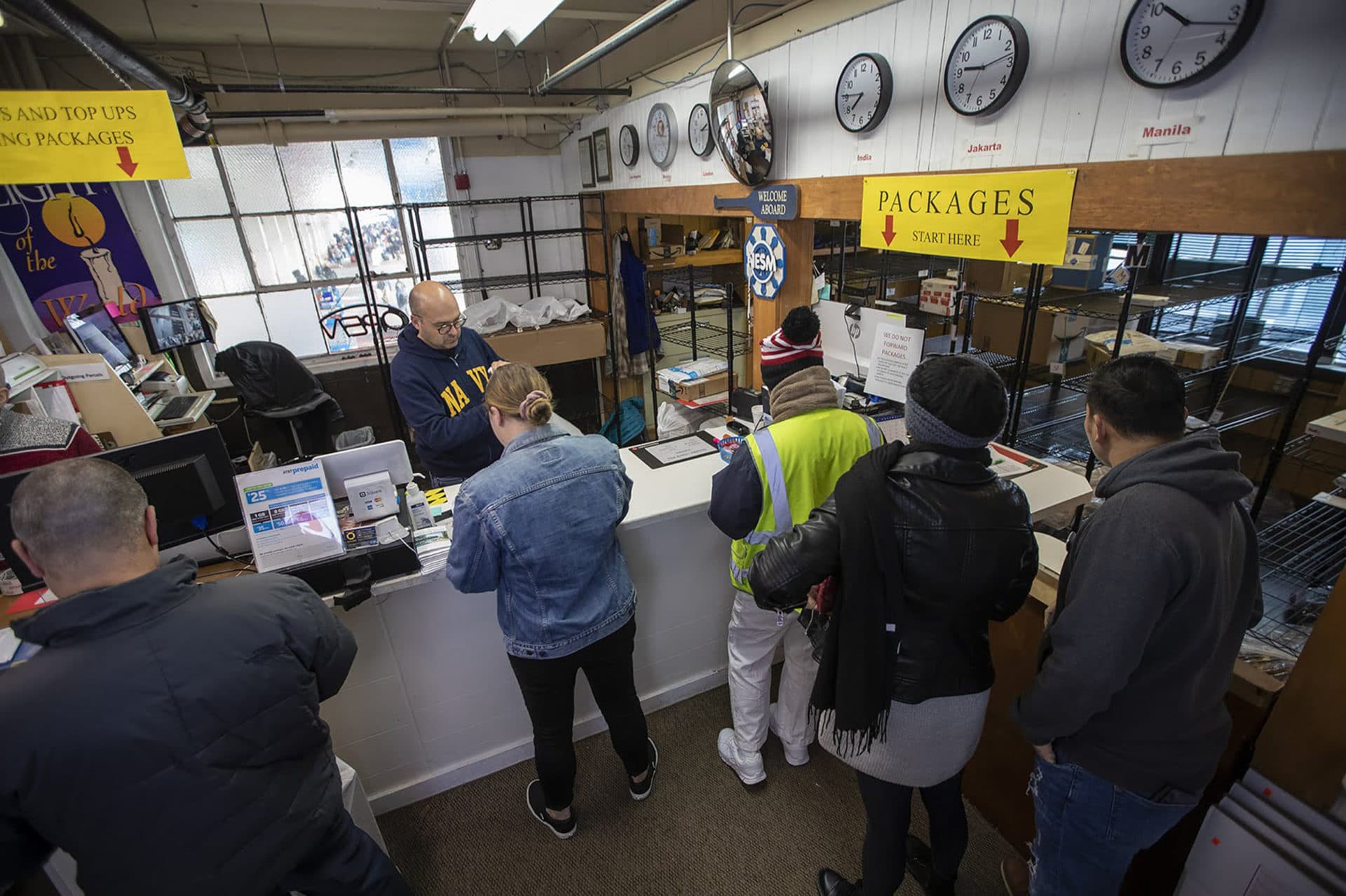 Jonathan Smith, an intern at the mission, runs the post office on the second floor. (Jesse Costa/WBUR)