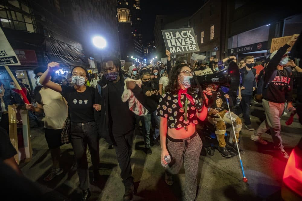 Protesters march down Washington Street in Downtown Crossing towards City Hall during the Justice for Breonna Taylor rally. (Jesse Costa/WBUR)