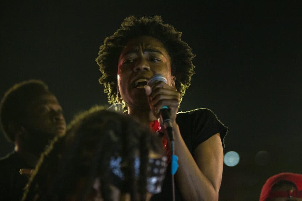 Vari Dudley of Black Boston speaks to protesters gathered in front of City Hall. (Jesse Costa/WBUR)