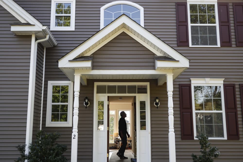 A man tours his new home (John Minchillo/AP)