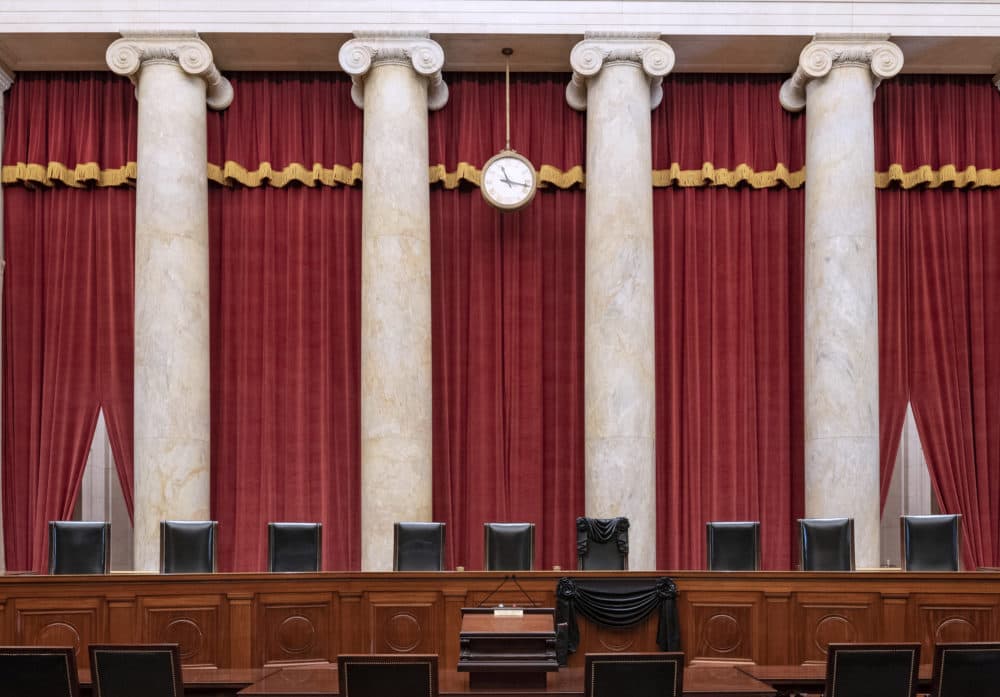 In this handout photo provided by the Supreme Court of the United States, the bench and seat of Associate Justice Ruth Bader Ginsburg is draped in black cloth after her death, on September 19, 2020 in Washington, D.C. Ginsburg was appointed to the Court by President Bill Clinton in 1993. The tradition of honoring a deceased justice in this way dates back to at least the 1870s. (Fred Schilling/Collection of the Supreme Court of the United States/Getty Images)