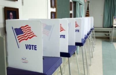 Voting booths set up and ready to receive voters inside a polling station in Florida in 2016. (Gregg Newton/AFP/Getty Images)