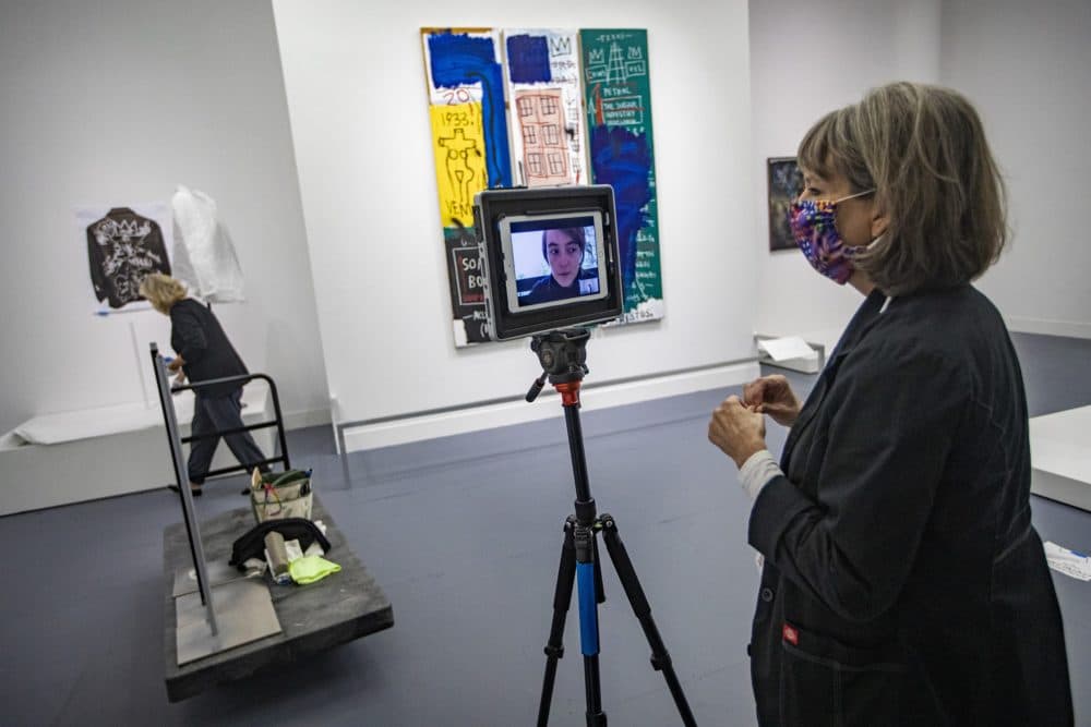 Head registrar Jill Kennedy-Kernohan on a remote Zoom check-in call with the exhibit's project manager Valentine Lescar assuring pieces in the "Writing the Future: Basquiat and the Hip-Hop Generation" exhibit have been properly installed. (Jesse Costa/WBUR)