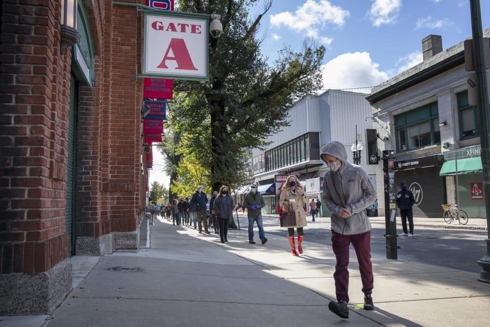 After waiting in the long line on Jersey Street, voters walk into Fenway Park to vote. (Robin Lubbock/WBUR)