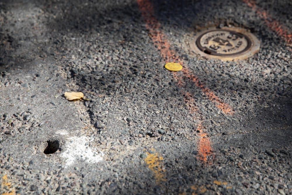 A hole in Temple Street, which Camargo says was made to test for gas leaks and could now be venting gas from underground. (Robin Lubbock/WBUR)