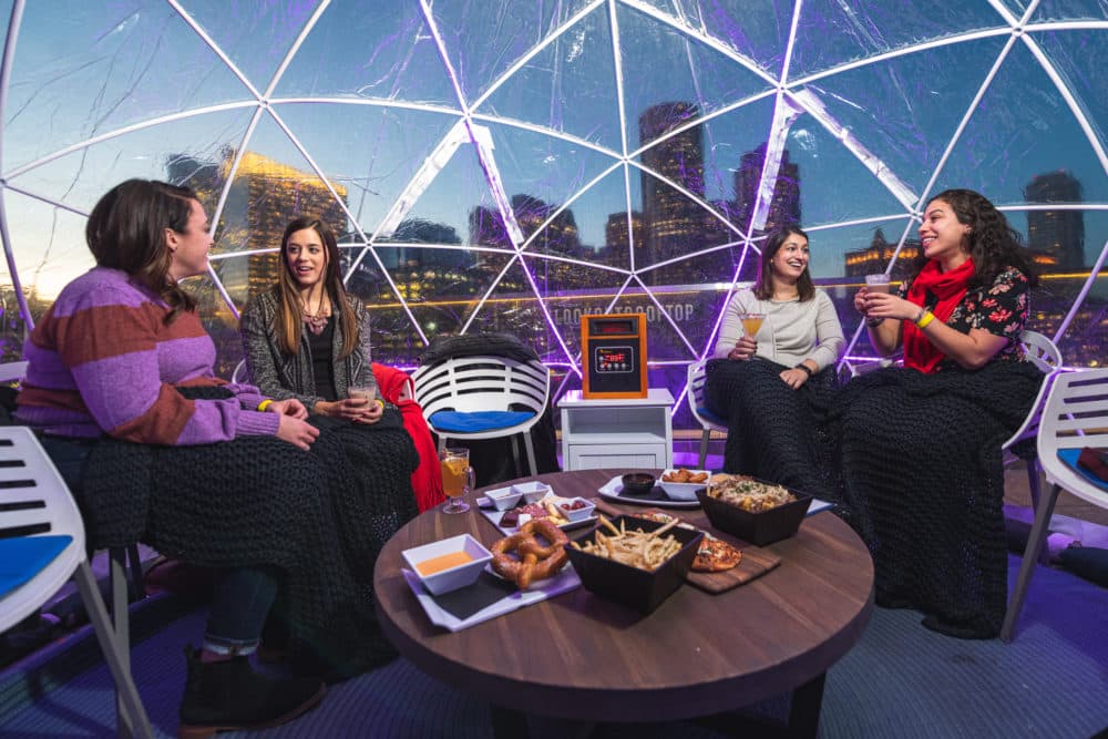 Diners enjoying a meal inside igloos at Boston's Envoy Hotel. (Jason Wessel)