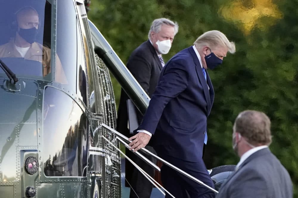 President Donald Trump arrives at Walter Reed National Military Medical Center, in Bethesda, Md., Friday, Oct. 2, 2020, on Marine One helicopter after he tested positive for COVID-19. White House chief of staff Mark Meadows is at second from left. (Jacquelyn Martin/AP)