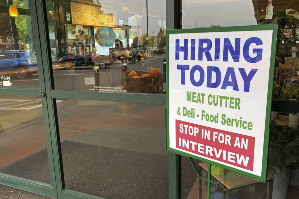 A sign that reads "hiring today," is shown at a grocery store in Olympia, Wash., advertising a job opportunity for a meat cutter on Oct. 3, 2020. (Ted S. Warren/AP)