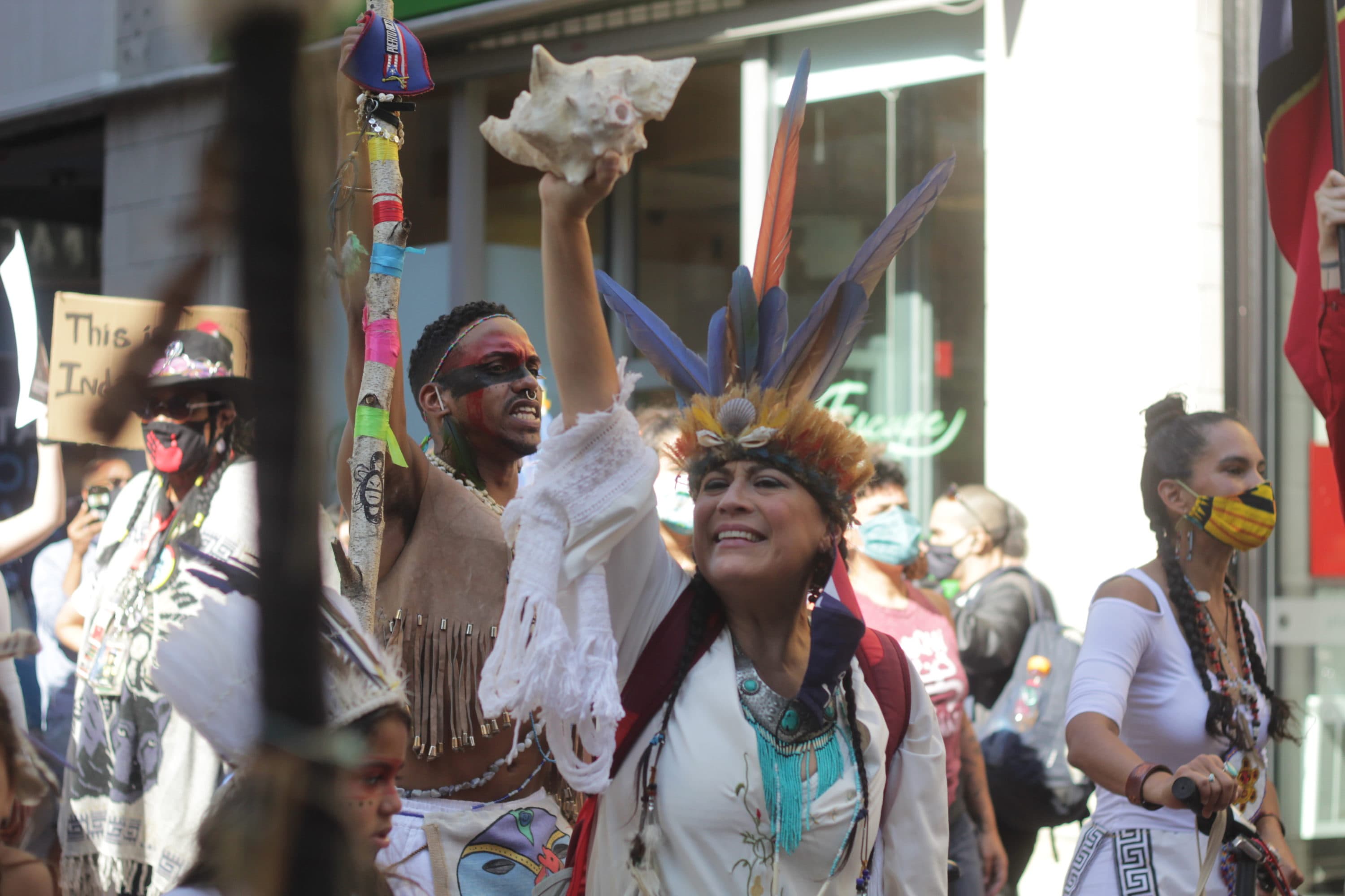 Chali'Naru Dones and other protesters call for Indigenous Peoples' Day to replace Columbus Day in Boston. (Quincy Walters/WBUR)