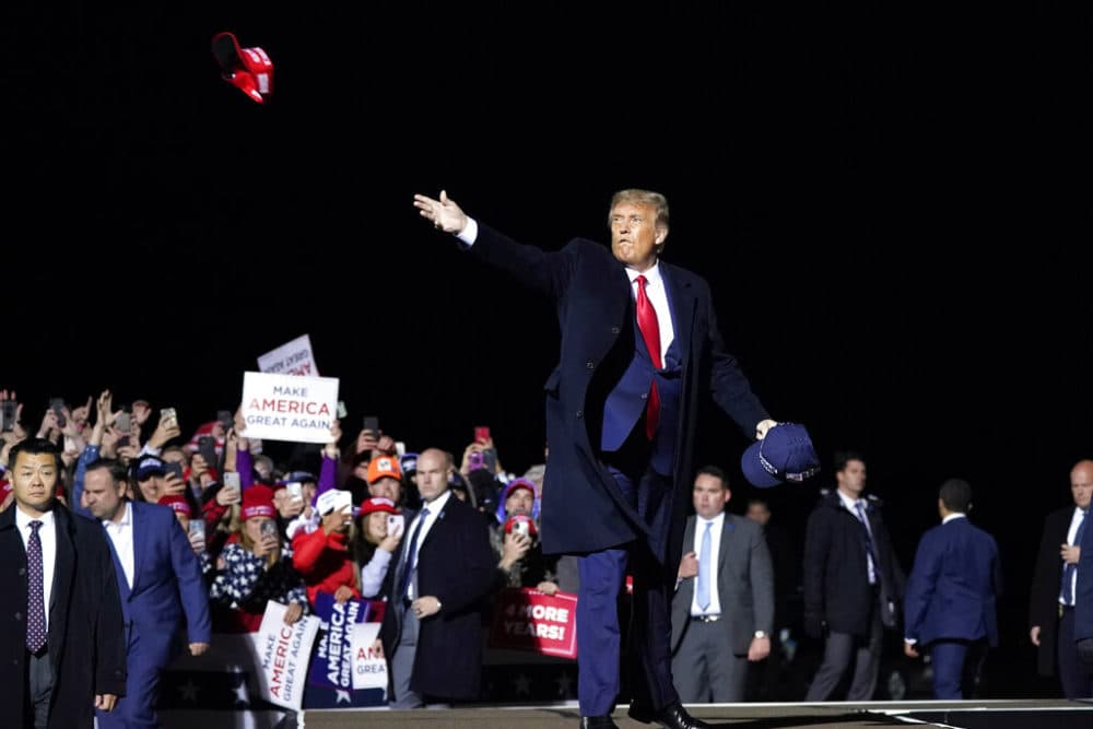 In this Wednesday, Sept. 30, 2020 file photo, President Donald Trump throws hats to supporters after speaking at a campaign rally at Duluth International Airport in Duluth, Minn. (Alex Brandon/AP)