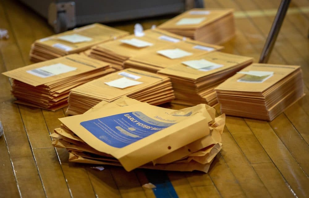 Early voters' ballots wait to be counted at East Boston High School polling station. (Robin Lubbock/WBUR)