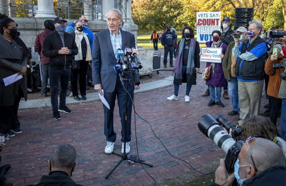 Sen. Ed Markey and his sneakers talk to the press at a rally on Boston Common. (Robin Lubbock/WBUR)