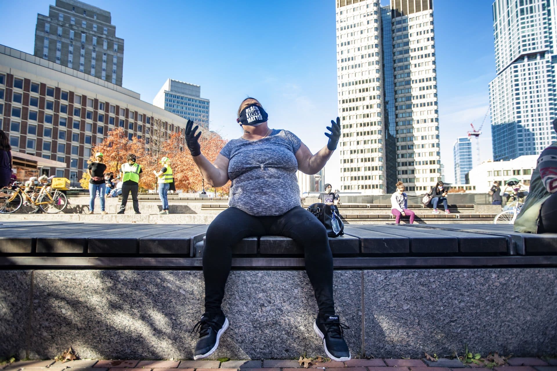 Anne Thiebeau moves to the music being played during the What this Win Means for Black Lives rally at City Hall Plaza. (Jesse Costa/WBUR)