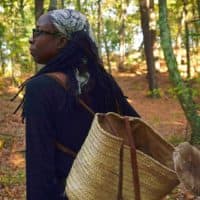 Maria Pinto leads groups into the woods on mushroom foraging trips. (Arielle Gray/ WBUR)