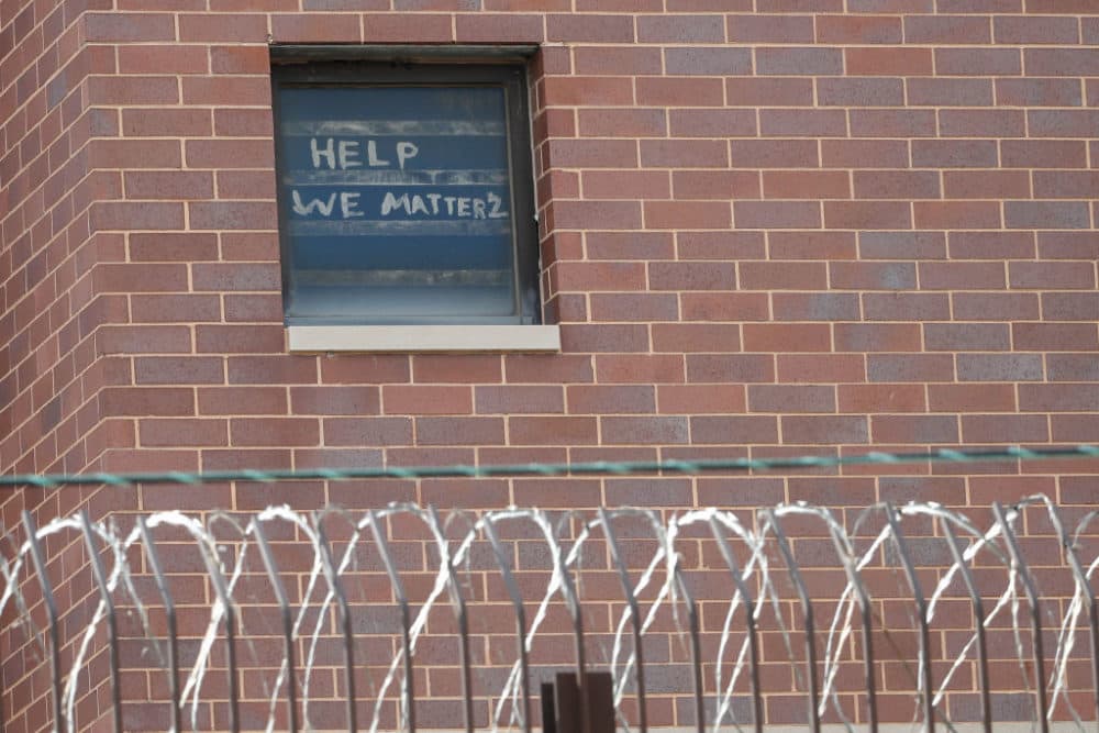The words "help we matter 2" are seen written in a window at the Cook County Department of Corrections (CCDOC), housing one of the nation's largest jails, in Chicago, Illinois, on April 9, 2020. (Photo by Kamil Krzaczynski/AFP via Getty Images)