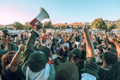 A crowd of protesters gather during a rally on Sept. 18, 2020 in Louisville, Kentucky. Protesters rallied in front of the attorney general's office for a decision to be made regarding the Louisville Metro police officers involved in the death of Breonna Taylor, who was fatally shot during a no-knock warrant at her apartment on March 13, 2020. (Jon Cherry/Getty Images)