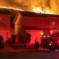 Flames come close to houses during the Blue Ridge Fire on October 27, 2020 in Chino Hills, California. (David McNew/Getty Images)