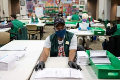Election judges verify and count ballots at the Denver Elections Division building on November 3, 2020 in Denver, Colorado. (CHET STRANGE/AFP via Getty Images)