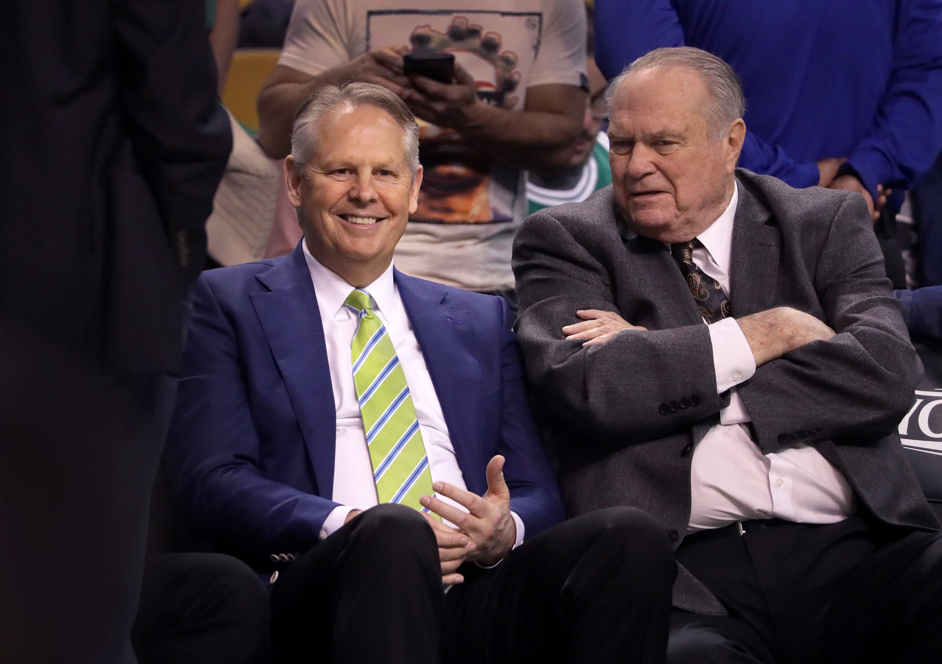 Danny Ainge, General Manager and President of Basketball Operations for the Boston Celtics watches the pre game warm ups with former Celtic great Tommy Heinsohn. (Barry Chin/The Boston Globe via Getty Images)
