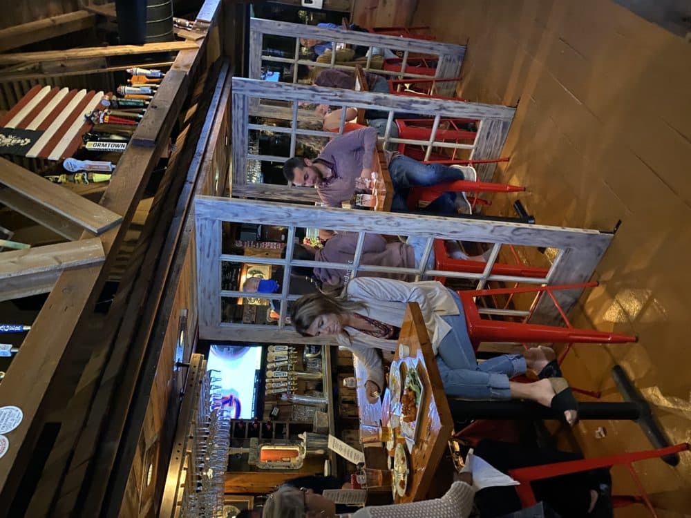The bar area at the Lobster Trap restaurant in Bourne has old doors set up as dividers between seats. (Courtesy Max Rubin/The Lobster Trap)