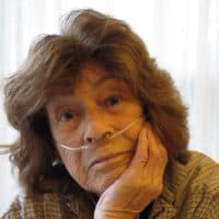 Alice Brock in her small Provincetown cottage (Andrea Shea/WBUR)