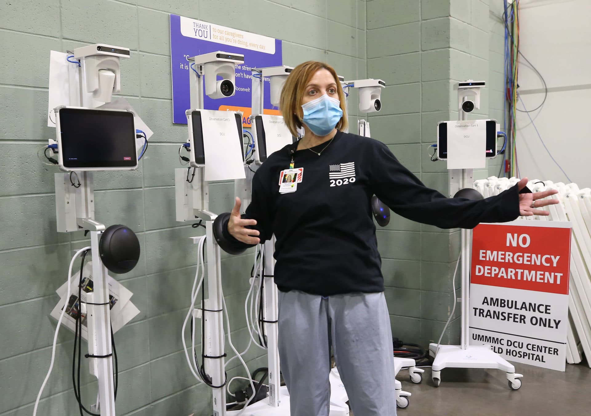 Janelle Forget, Associate Vice President of risk management, UMass Memorial, shows off camera equipment to connect the patients to medical professionals at the DCU Center. (Nancy Lane/MediaNews Group/Boston Herald)
